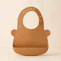 Bear Pocket Bib arranged as a clean baby shower product photo