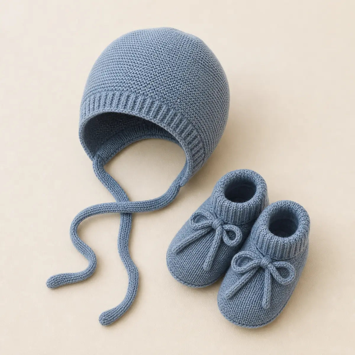 Blue Sky Bonnet & Booties arranged as a clean baby shower product photo