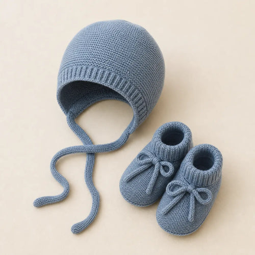 Blue Sky Bonnet & Booties arranged as a clean baby shower product photo