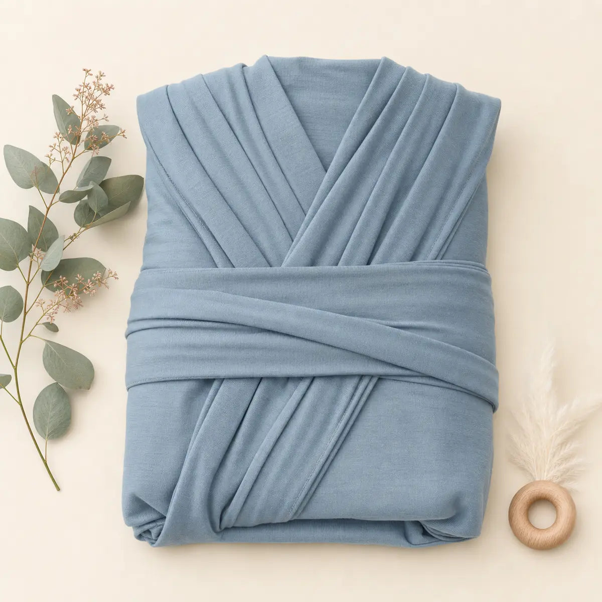 Bluebell Jersey Wrap arranged as a clean baby shower product photo