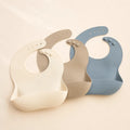 Cloud Bib Trio arranged as a clean baby shower product photo