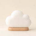 Cloud Night Light arranged as a clean baby shower product photo