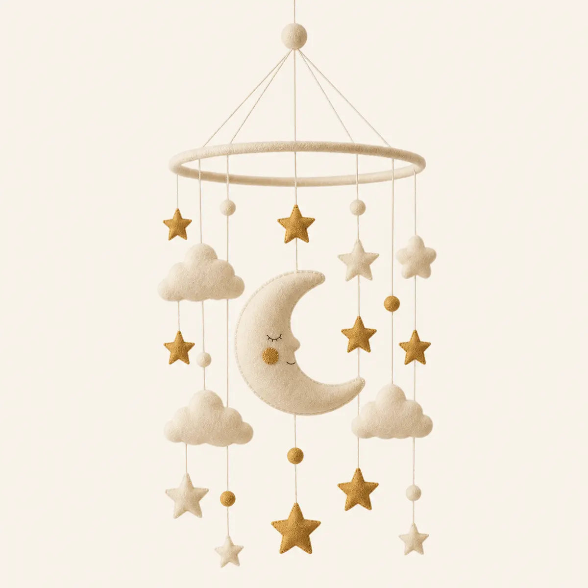Felt Moon Mobile arranged as a clean baby shower product photo