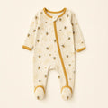 Honeybee Footie Pajamas arranged as a clean baby shower product photo