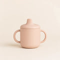Little Sips Training Cup arranged as a clean baby shower product photo