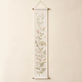 Meadow Growth Chart arranged as a clean baby shower product photo