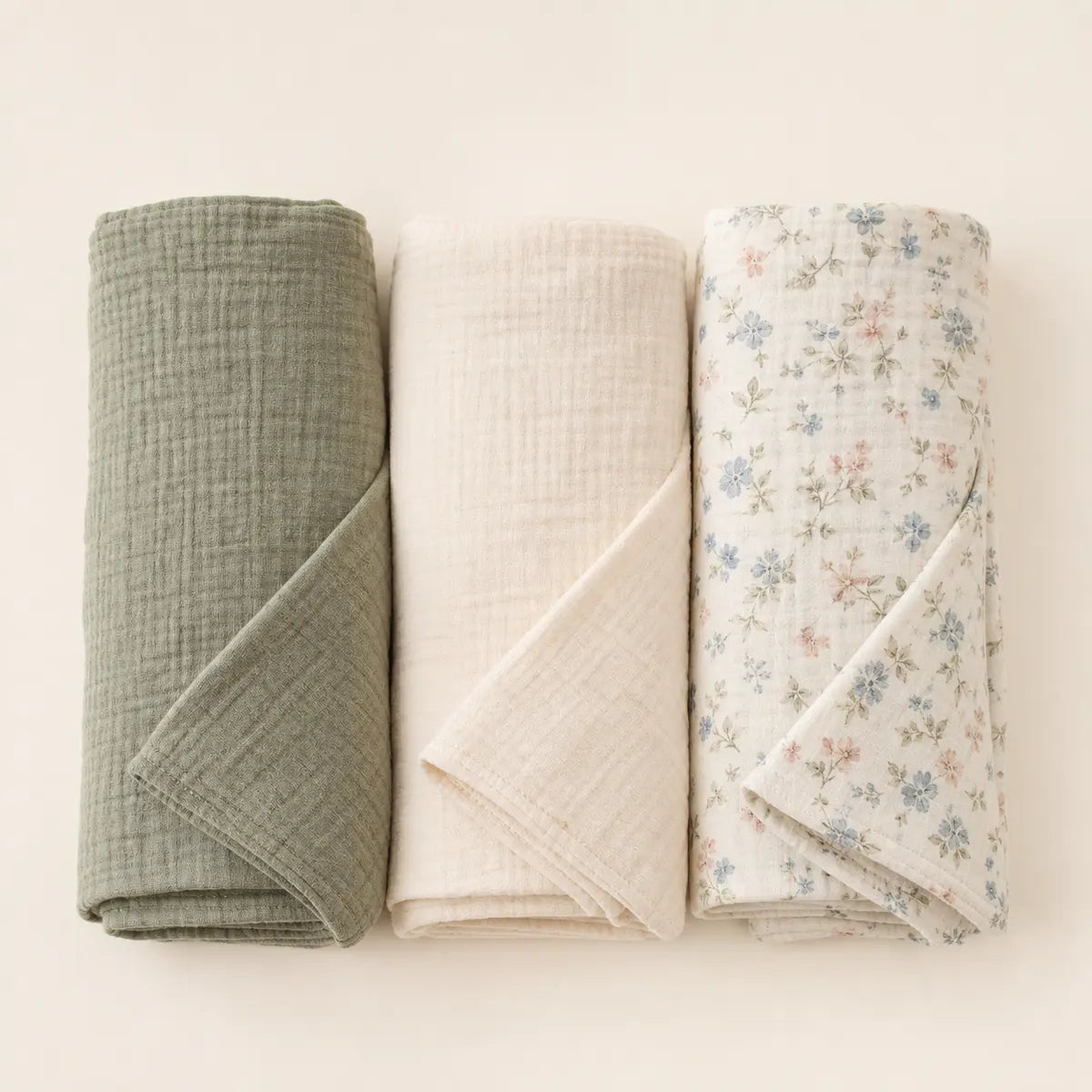 Meadow Muslin Swaddle Set arranged as a clean baby shower product photo