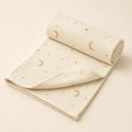 Moon & Stars Receiving Blanket arranged as a clean baby shower product photo