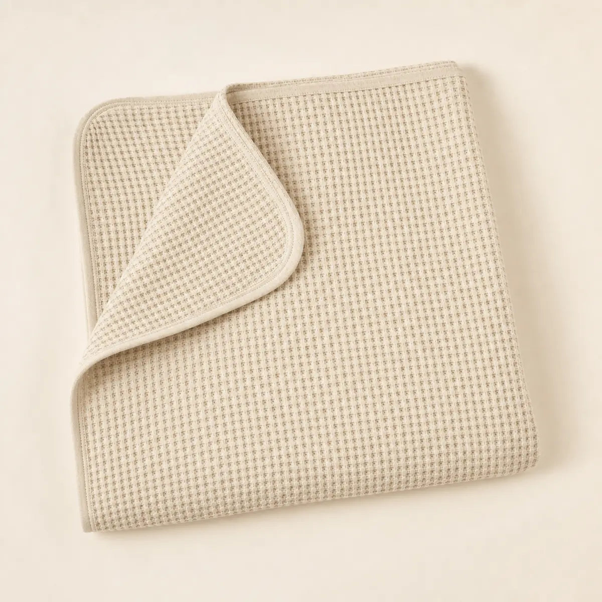 Oatmeal Waffle Stroller Blanket arranged as a clean baby shower product photo