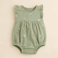 Sage Meadow Romper arranged as a clean baby shower product photo