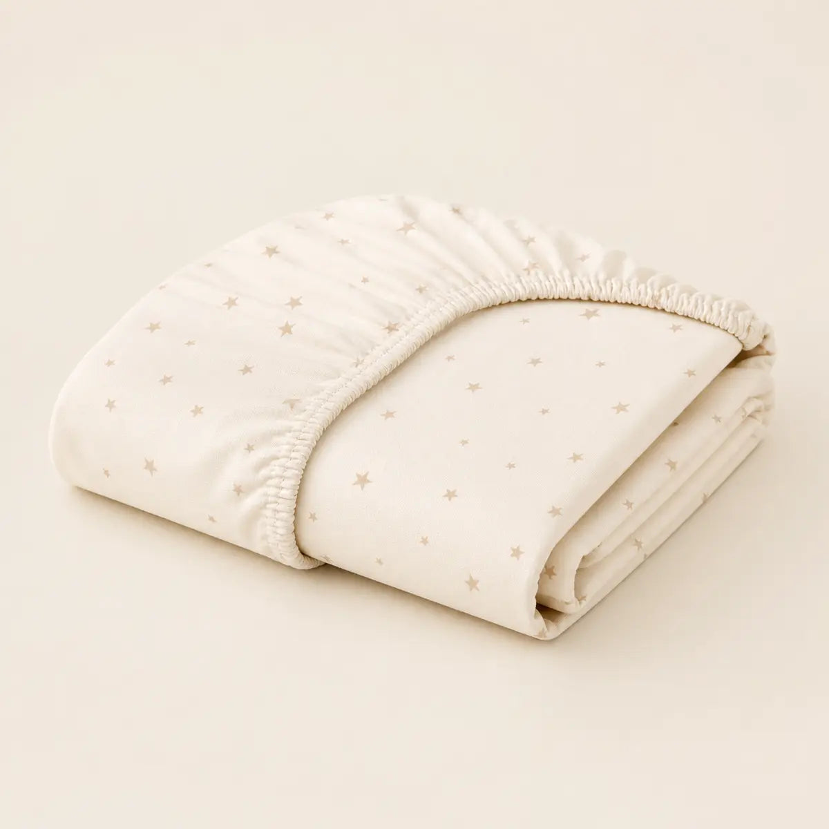 Starry Crib Sheet arranged as a clean baby shower product photo