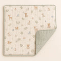 Woodland Muslin Quilt arranged as a clean baby shower product photo