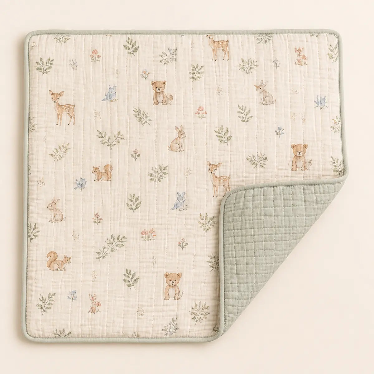 Woodland Muslin Quilt arranged as a clean baby shower product photo
