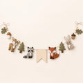 Woodland Name Garland arranged as a clean baby shower product photo